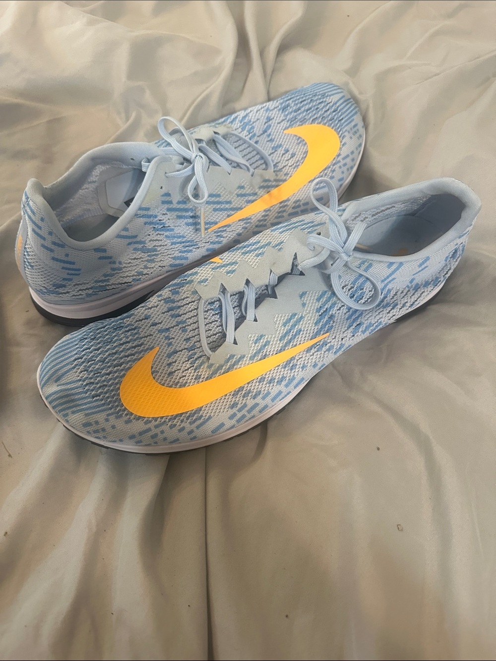Nike Light Blue Running Shoes with Yellow Swoosh